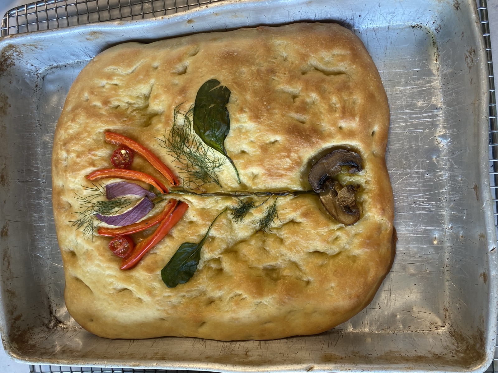 Students baking fresh focaccia together in a cooking class